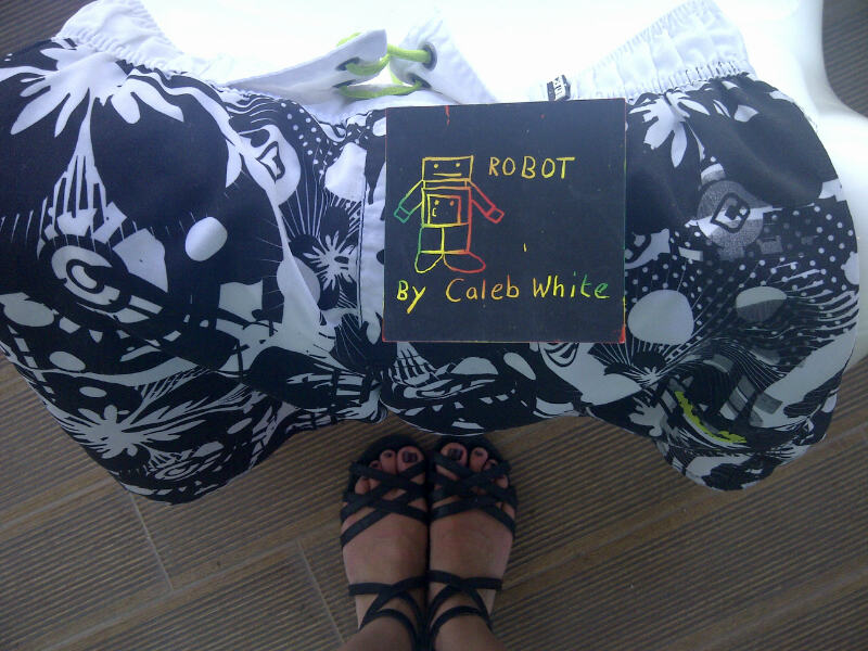 Bot supervising the drying of swimming gear cool boardies caleb