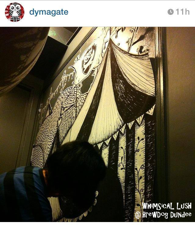 Action shot of me pasting up giant circus print Pic by Dymagate who helped me install the print and originals